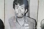 Prisonnier terrorisé photographié à son arrivée à Tuol Sleng, Phnom Penh, Cambodge.