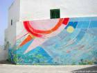Peinture solaire, mural restant du festival de peinture, Asilah, Maroc.