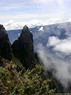 Aiguille du Piton Maïdo au-dessus de Mafate ennuagé, La Réunion.