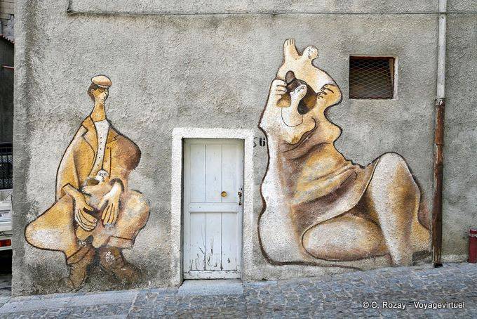 Orgosolo, histoire de famille, fresque sur façade, Via Alcide Gasperi - Sardaigne