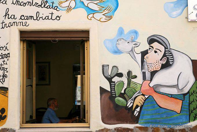 Orgosolo, le paysan et son veau regardant les colombes, murales - Sardaigne