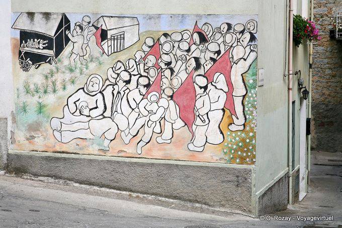 Orgosolo, la manifestation et les drapeaux rouges, murales - Sardaigne