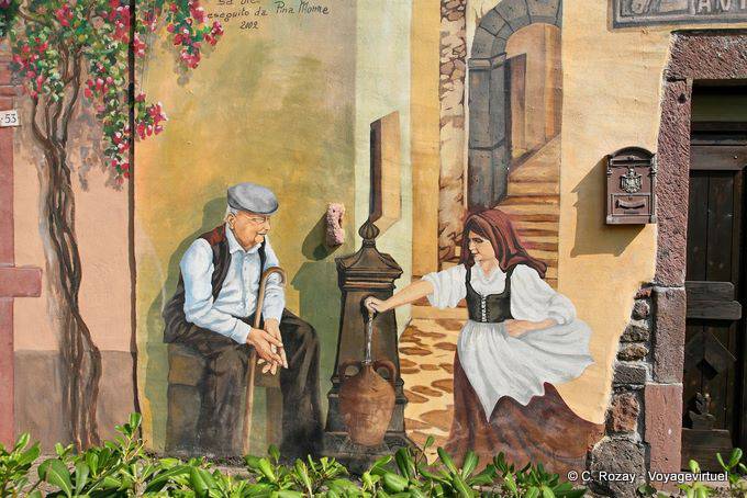 Tinnura, une discussion à la fontaine, murales - Sardaigne