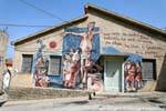 Orgosolo, Deus Bonu, fresque sur la façade d'une maison, Sardaigne.